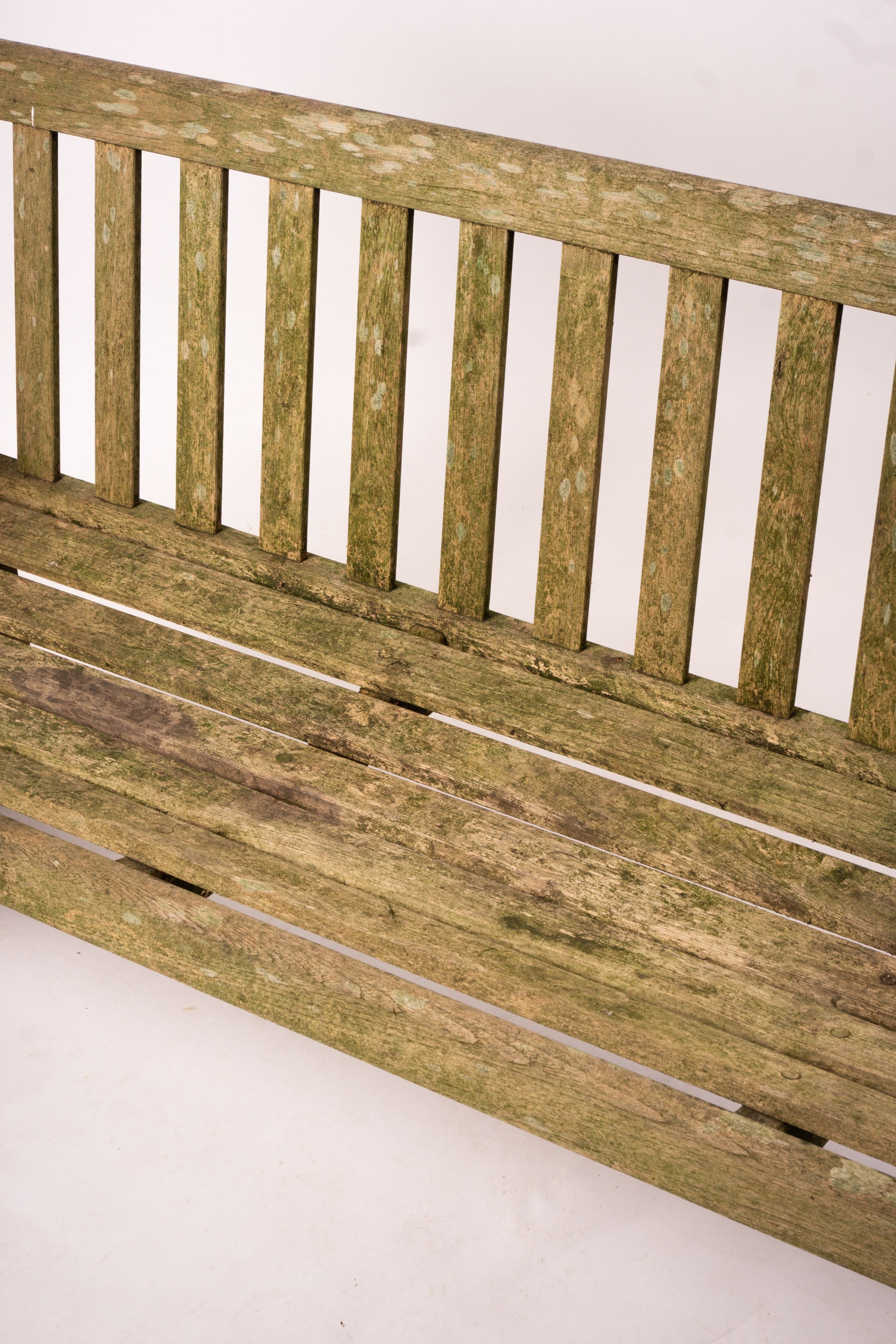 A weathered teak garden bench, length 192cm, width 60cm, height 85cm